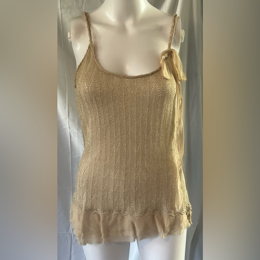 Gold spaghetti strap camisole with lace on the hem.